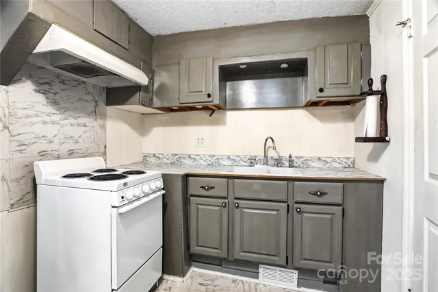 a view of a livingroom with furniture and front door