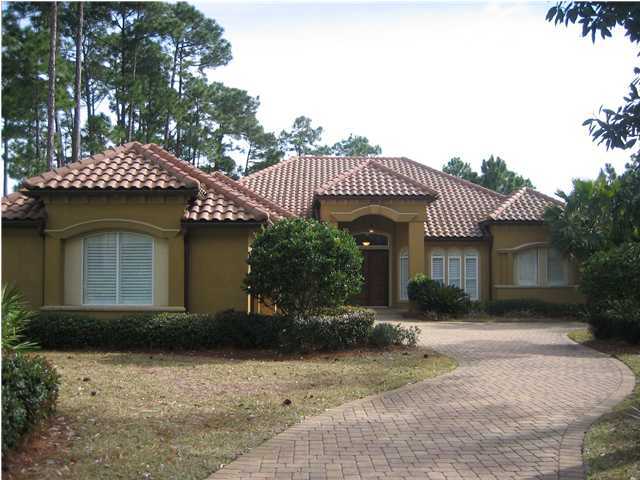 4466 Stonebridge Road Destin, FL 32541 - Photo 2 of 21 a front view of a house with a garden