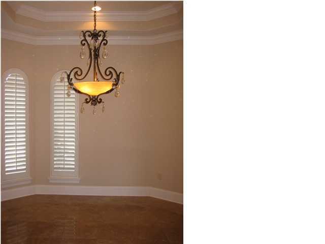 4466 Stonebridge Road Destin, FL 32541 - Photo 8 of 21 a view of a room with a window and chandelier