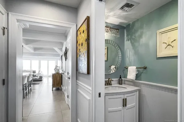 a en suite bathroom with a sink a mirror and shower