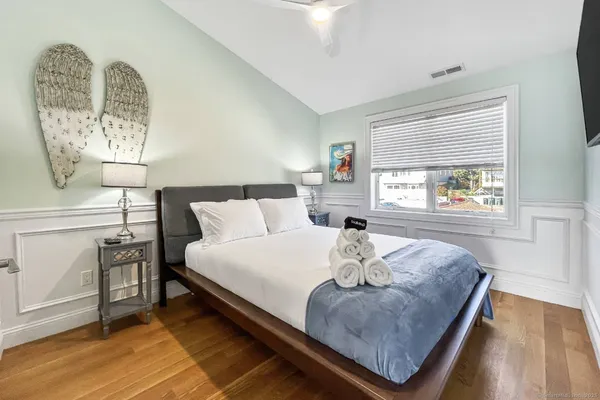 a bedroom with bed and window