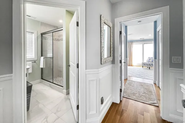 a view of a bathroom from a hallway