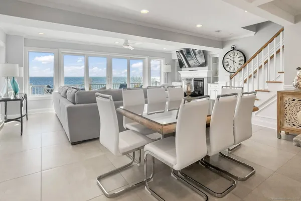 a living room with furniture gym equipment and a large window