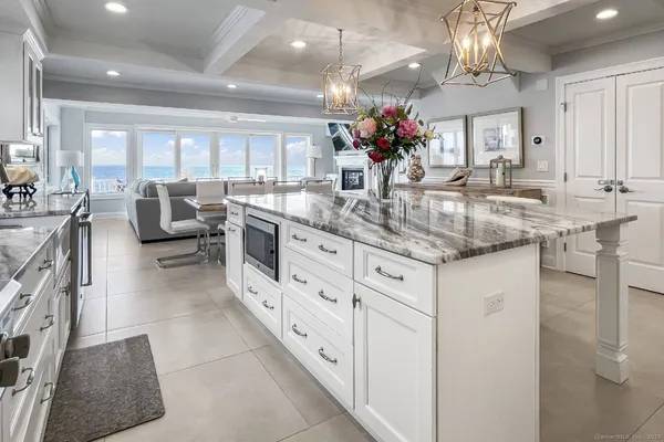 a kitchen with stainless steel appliances kitchen island granite countertop a sink and cabinets
