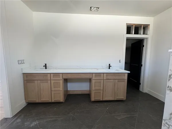 a room with cabinets and sink