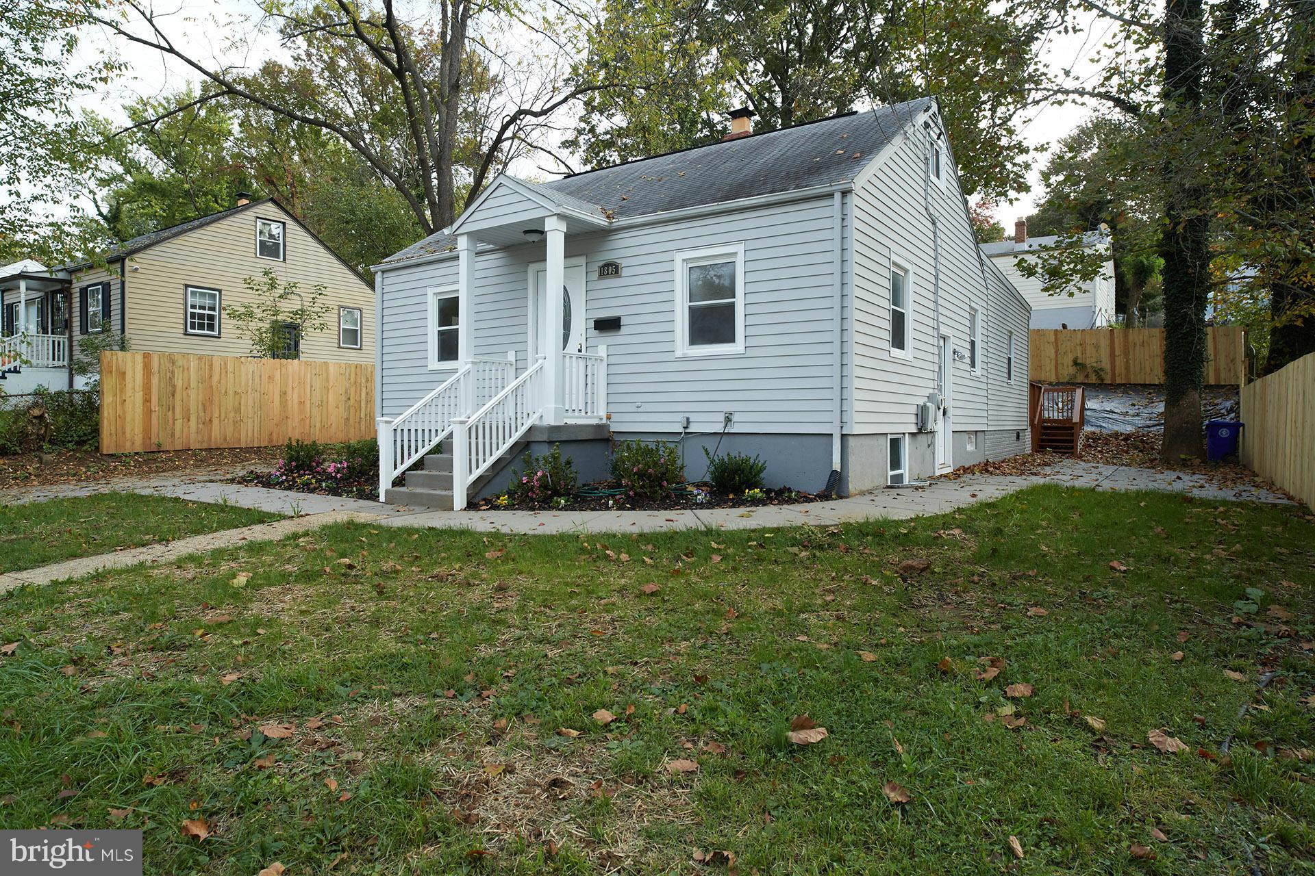 11805 Dewey Road Silver Spring, MD 20906 - Photo 1 of 30 a view of a house with a yard