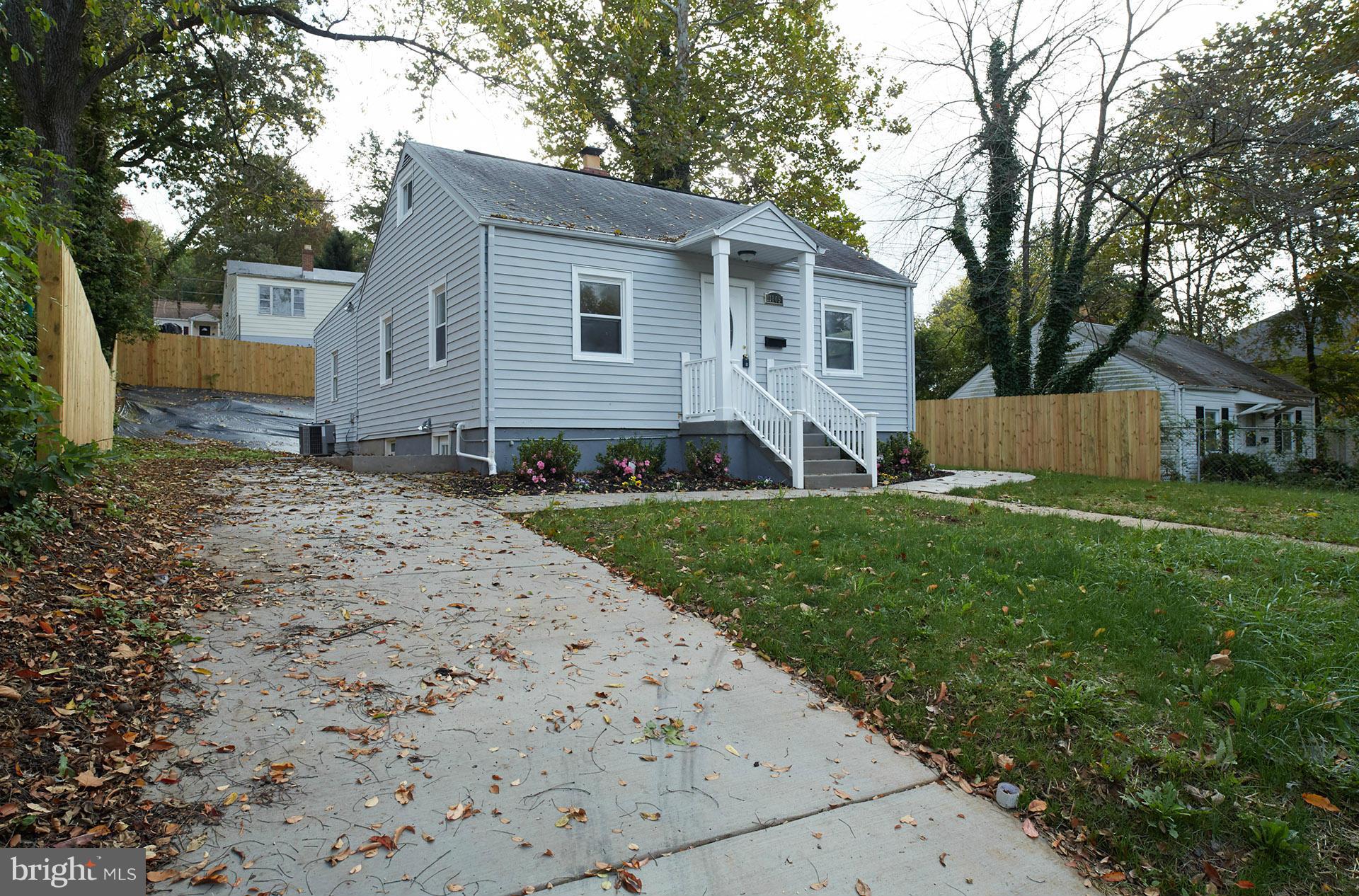 11805 Dewey Road Silver Spring, MD 20906 - Photo 2 of 30 a front view of house with yard and green space
