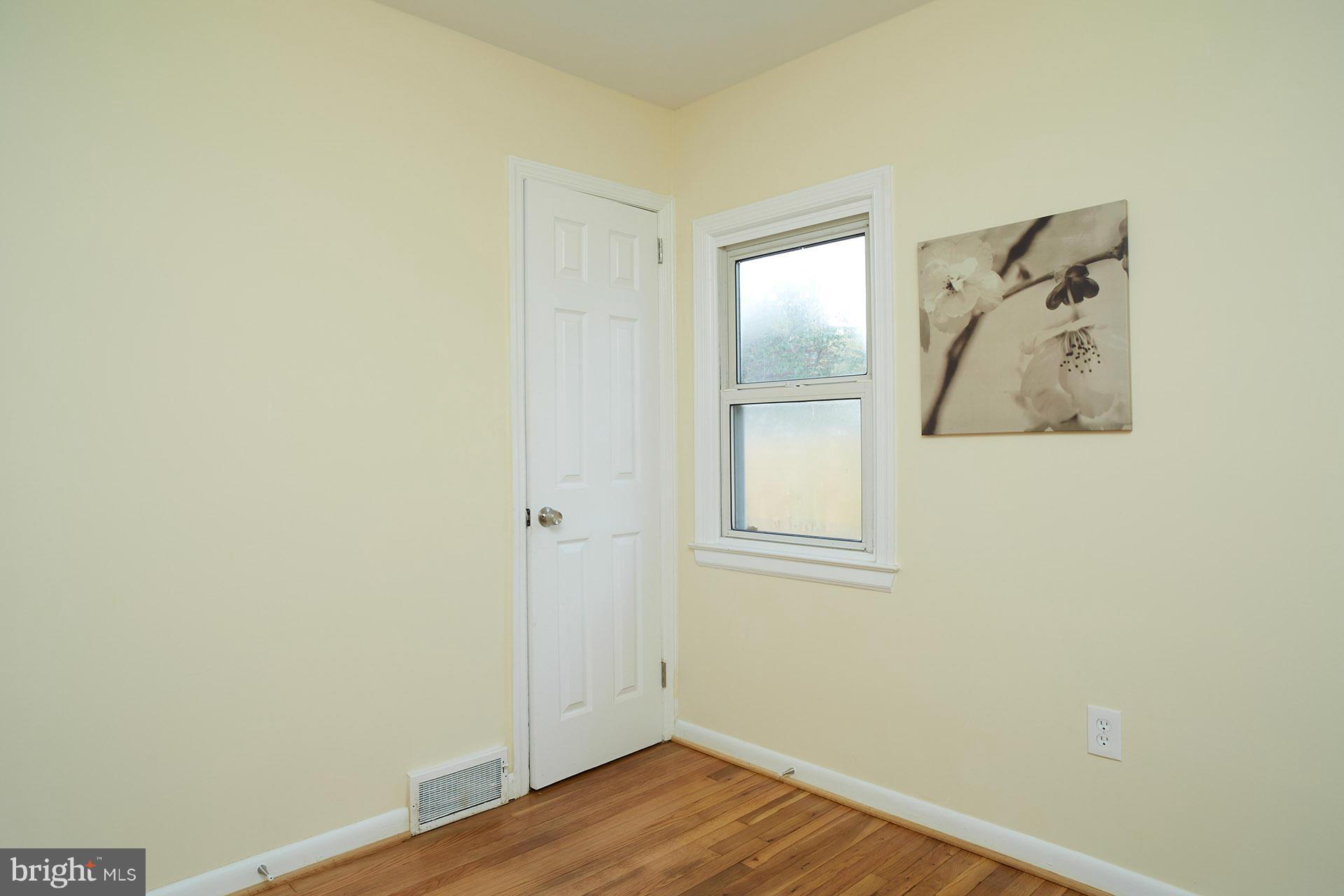 11805 Dewey Road Silver Spring, MD 20906 - Photo 20 of 30 a view of a small space with wooden floor and a window