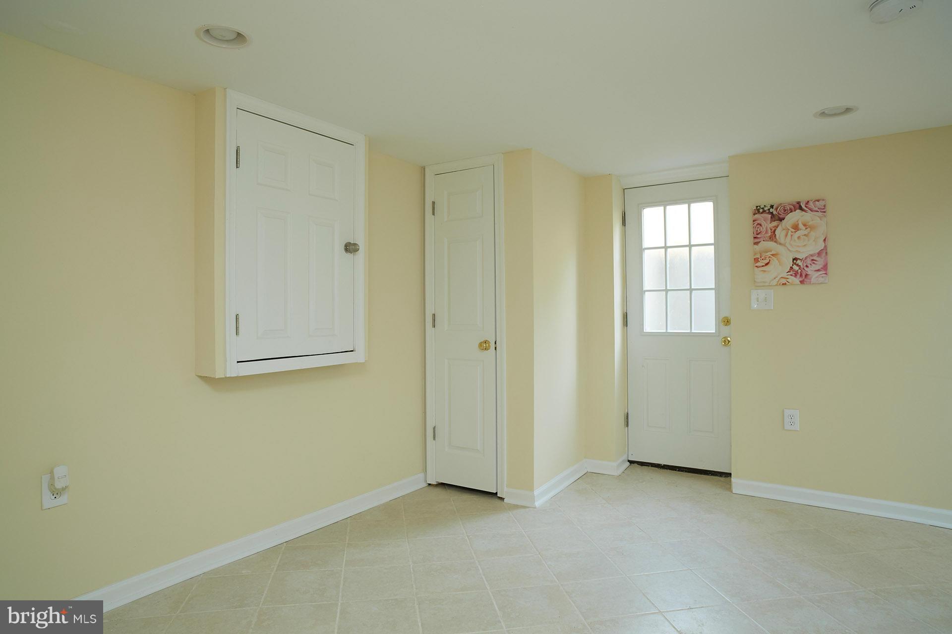 11805 Dewey Road Silver Spring, MD 20906 - Photo 25 of 30 a view of an empty room with a window