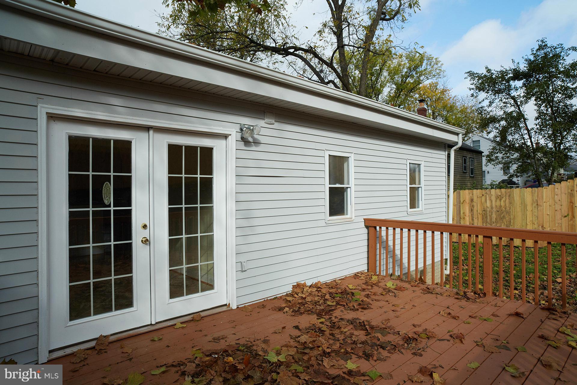 11805 Dewey Road Silver Spring, MD 20906 - Photo 28 of 30 a view of a backyard with a large tree