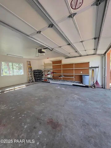 a view of livingroom with furniture and a window