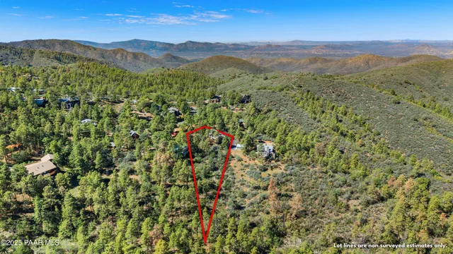 a view of a lush green hillside and a building