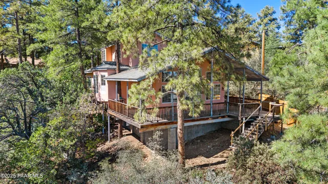 front view of a house with a tree