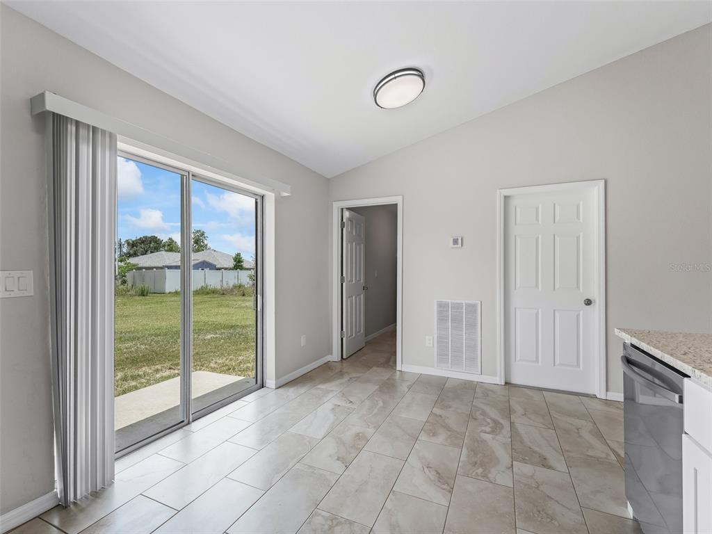 27 Juniper Loop Terrace Ocala, FL 34480 - Photo 12 of 35 a view of an empty room and window