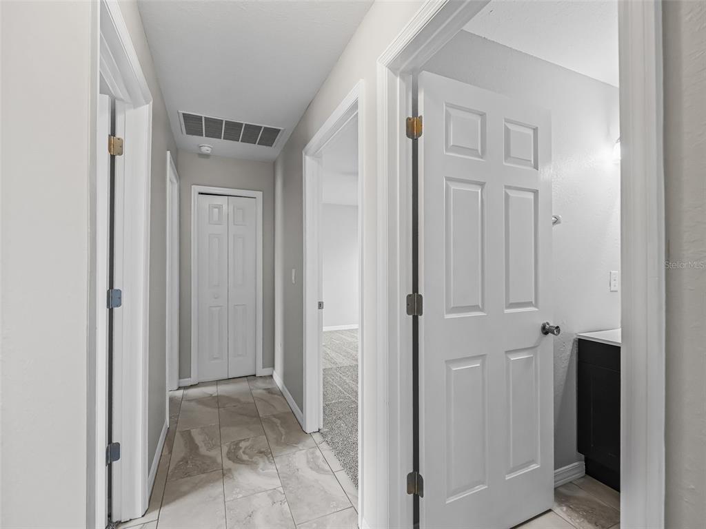 27 Juniper Loop Terrace Ocala, FL 34480 - Photo 14 of 35 a view of a hallway with closet area