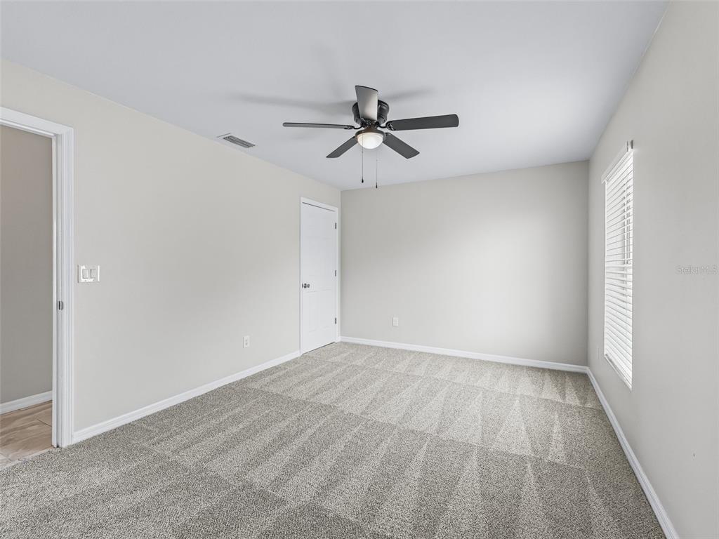27 Juniper Loop Terrace Ocala, FL 34480 - Photo 16 of 35 wooden floor in an empty room