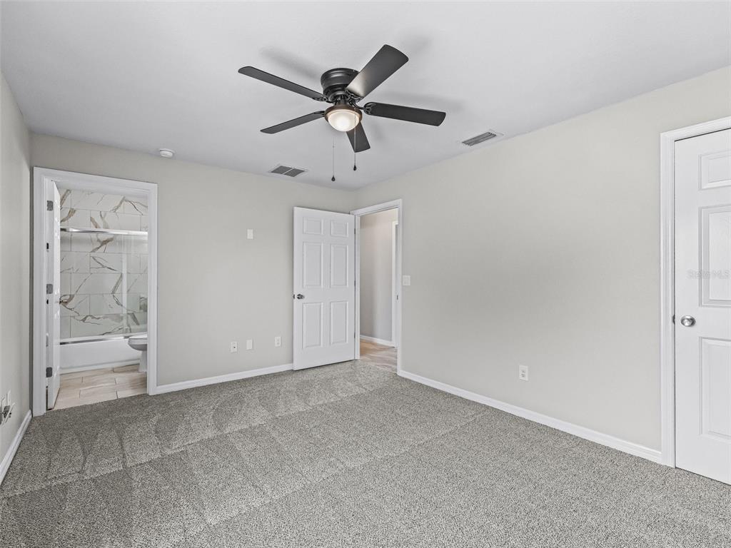 27 Juniper Loop Terrace Ocala, FL 34480 - Photo 18 of 35 a view of an empty room and window