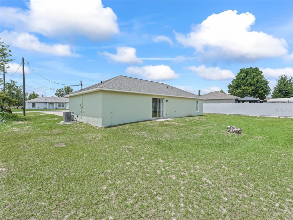 27 Juniper Loop Terrace Ocala, FL 34480 - Photo 28 of 35 a house view with a garden space