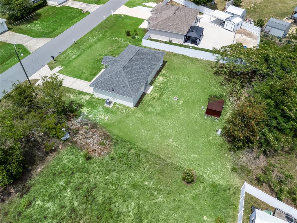 27 Juniper Loop Terrace Ocala, FL 34480 - Photo 33 of 35 an aerial view of a house with a yard