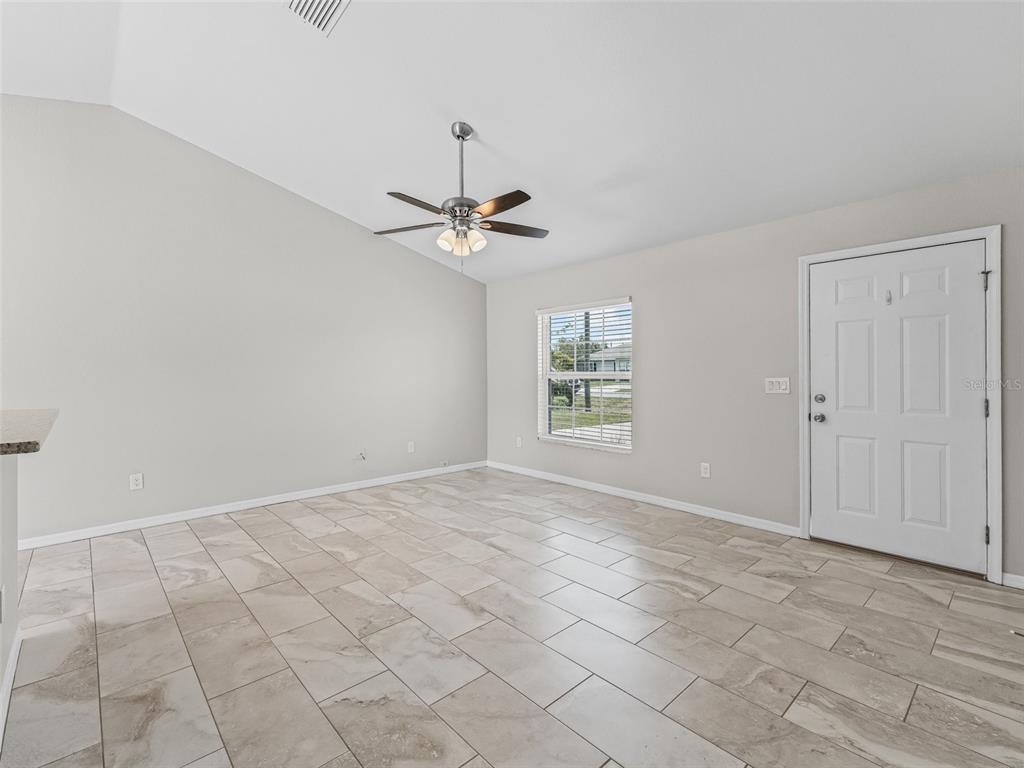 27 Juniper Loop Terrace Ocala, FL 34480 - Photo 4 of 35 a view of an empty room with a window