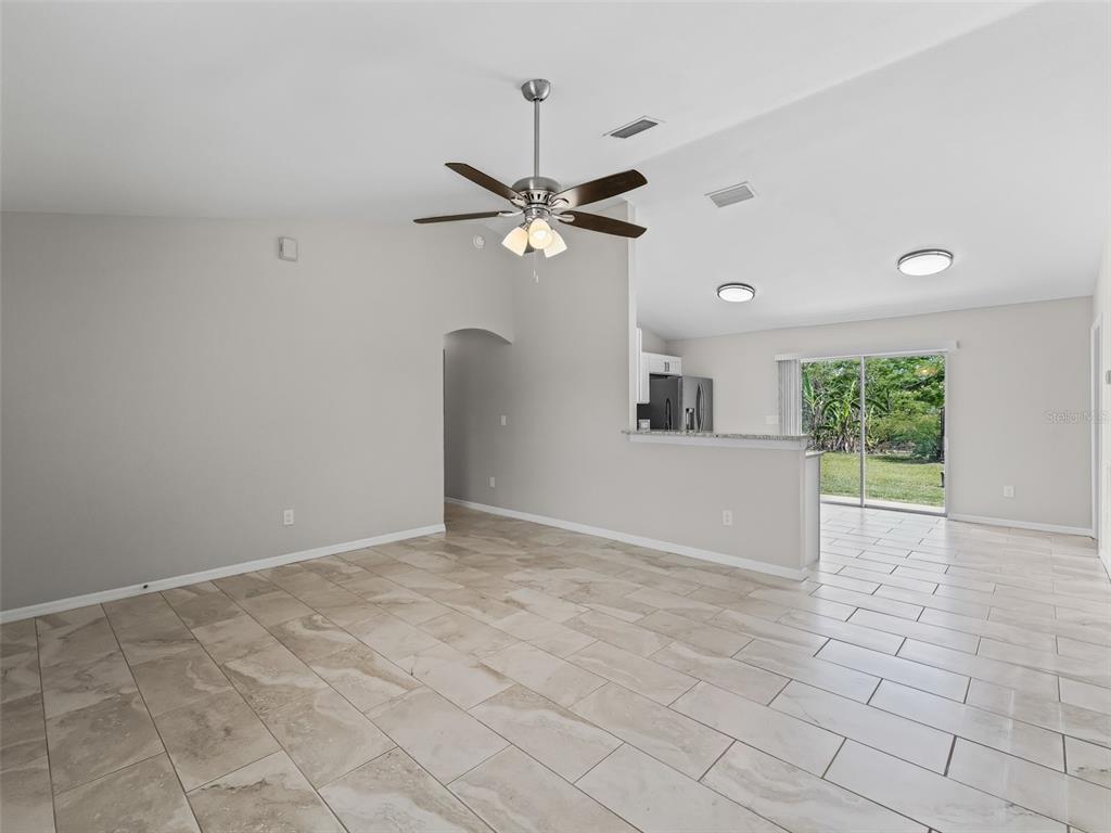 27 Juniper Loop Terrace Ocala, FL 34480 - Photo 6 of 35 a view of a livingroom with a ceiling fan and window