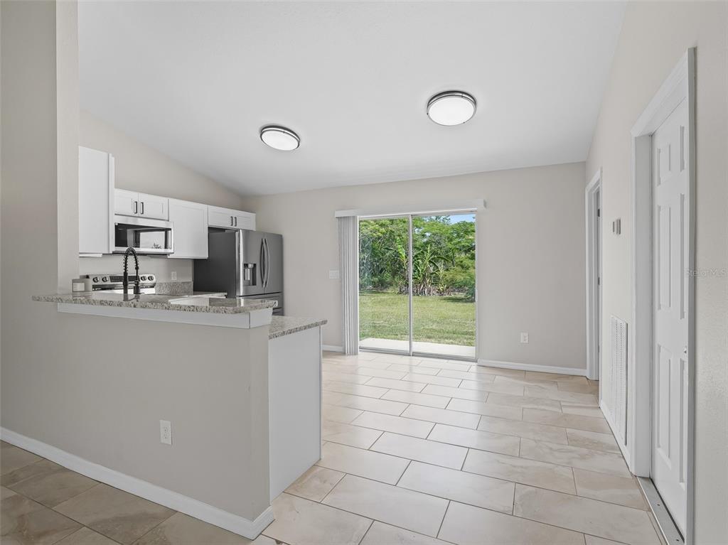 27 Juniper Loop Terrace Ocala, FL 34480 - Photo 7 of 35 a view of a kitchen with a sink and a window