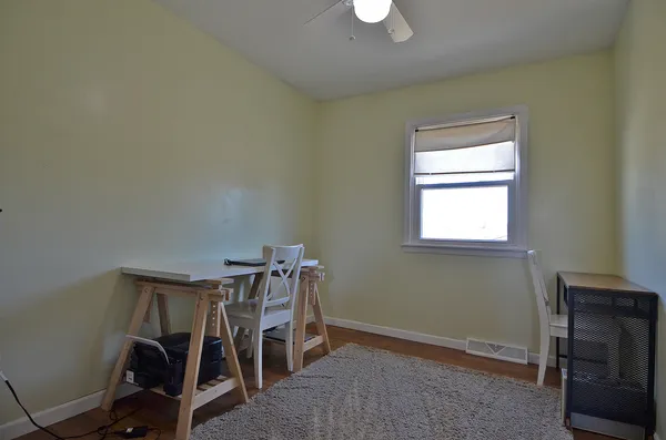 a bedroom with furniture and a window