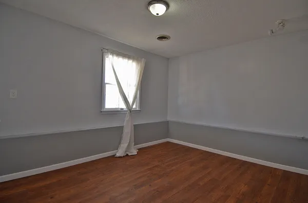 a house with a bed and a dresser