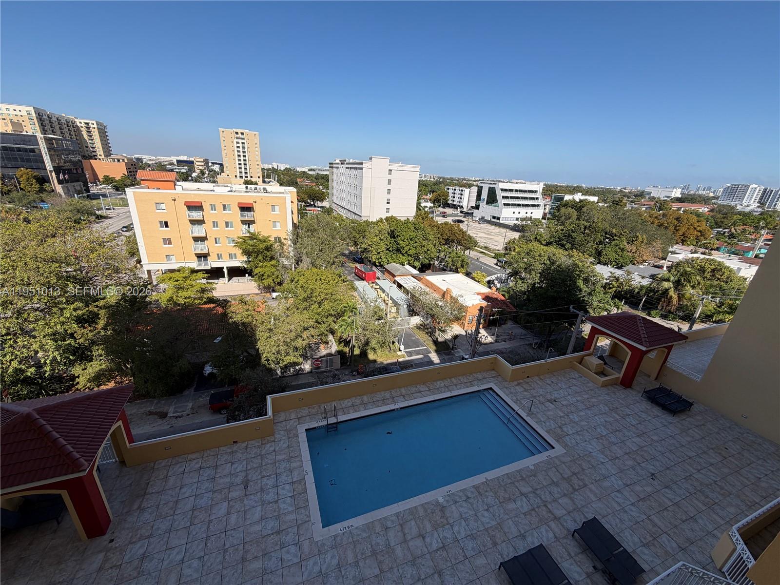 215 Southwest 42nd Avenue, Unit 803 Miami, FL 33134 - Photo 15 of 20 a view of a terrace with sitting area