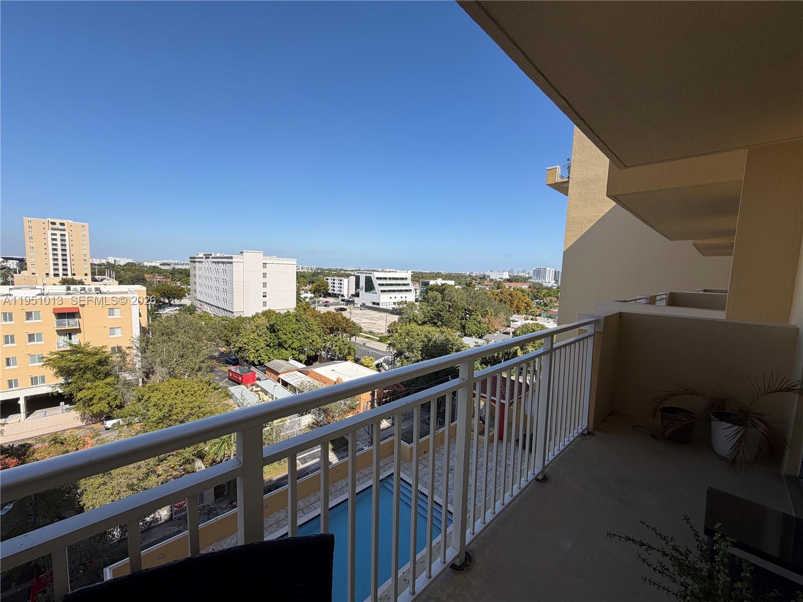 215 Southwest 42nd Avenue, Unit 803 Miami, FL 33134 - Photo 16 of 20 a view of city from a balcony