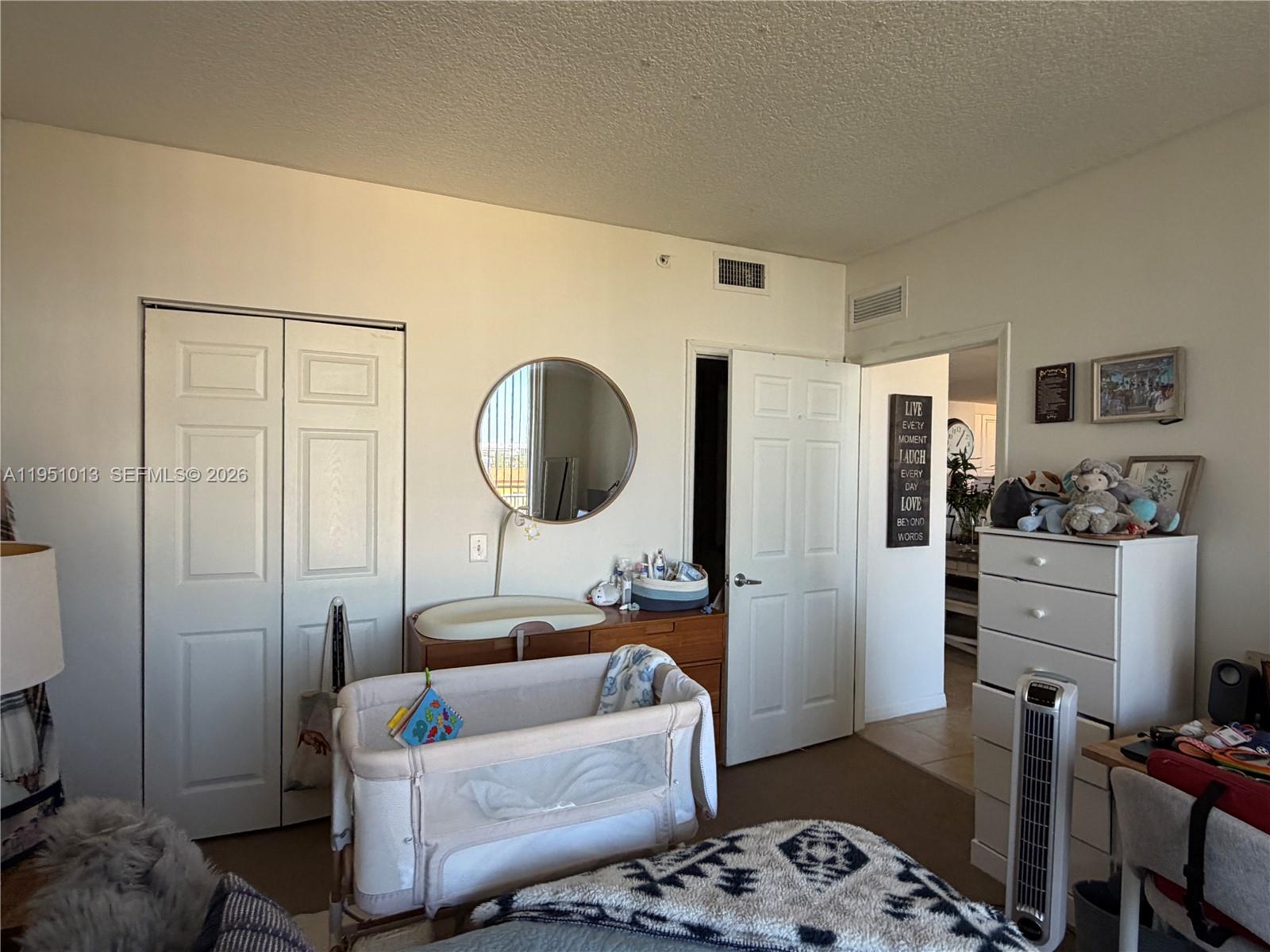 215 Southwest 42nd Avenue, Unit 803 Miami, FL 33134 - Photo 8 of 20 a living room with furniture and a wooden floor