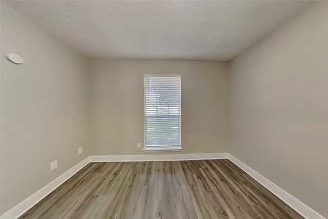 a view of wooden floor in an empty room