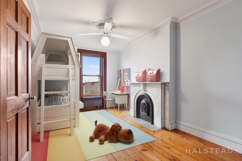192 6th Avenue Brooklyn, NY 11217 - Photo 13 of 20 a living room with furniture a fireplace and a flat screen tv