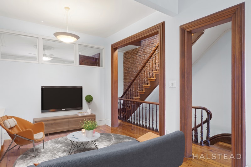 192 6th Avenue Brooklyn, NY 11217 - Photo 15 of 20 a living room with furniture and a flat screen tv