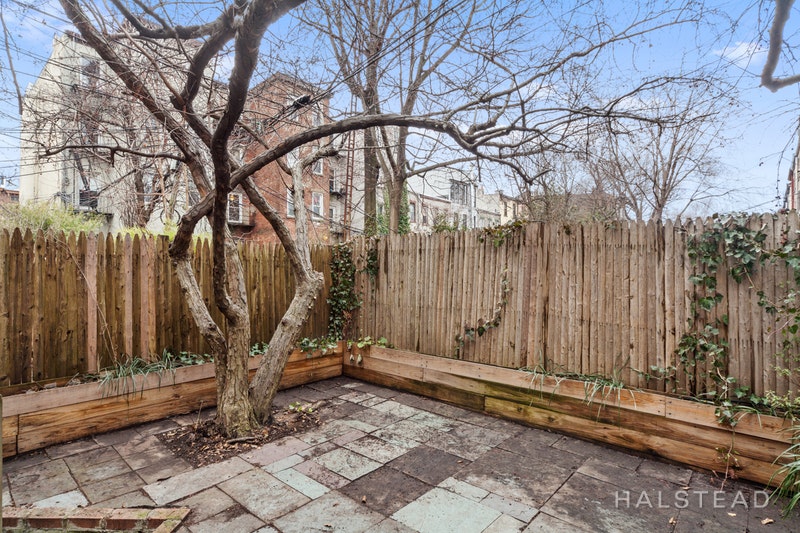 192 6th Avenue Brooklyn, NY 11217 - Photo 19 of 20 a backyard of a house with a table and chairs