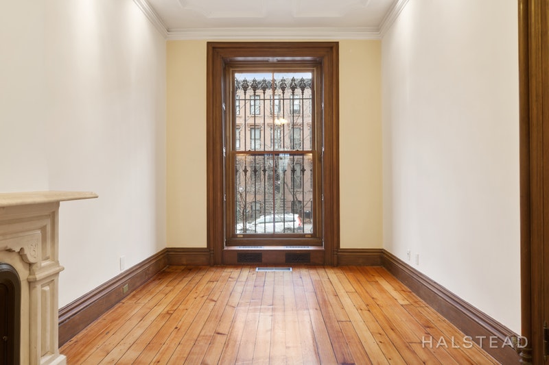 192 6th Avenue Brooklyn, NY 11217 - Photo 3 of 20 a view of an empty room with wooden floor and a window