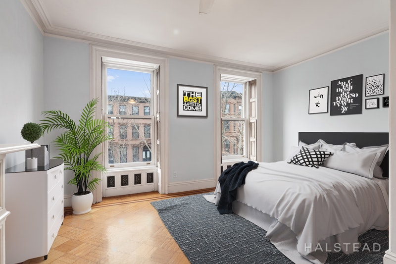 192 6th Avenue Brooklyn, NY 11217 - Photo 9 of 20 a bedroom with a large bed and a couch