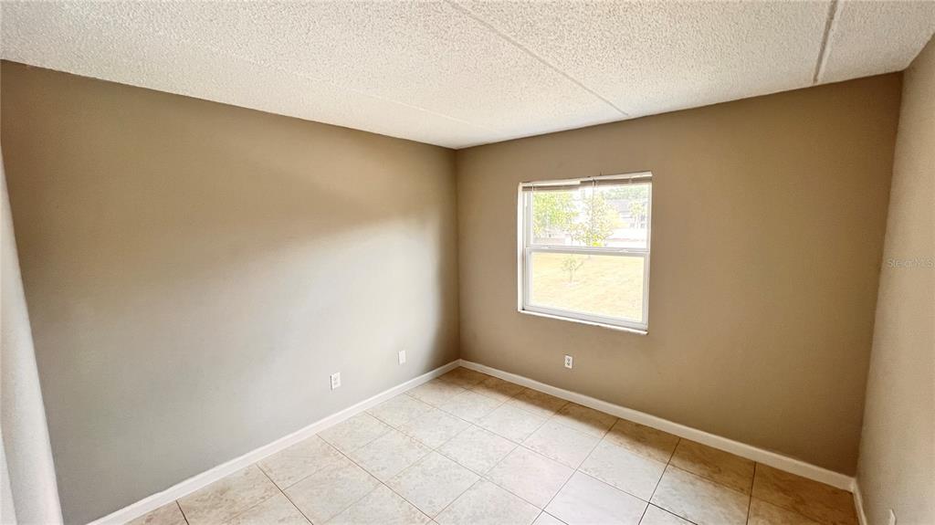 1902 Honour Road, Unit 24 Orlando, FL 32839 - Photo 16 of 25 a view of an empty room and window