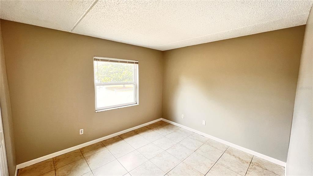 1902 Honour Road, Unit 24 Orlando, FL 32839 - Photo 18 of 25 an empty room with a window