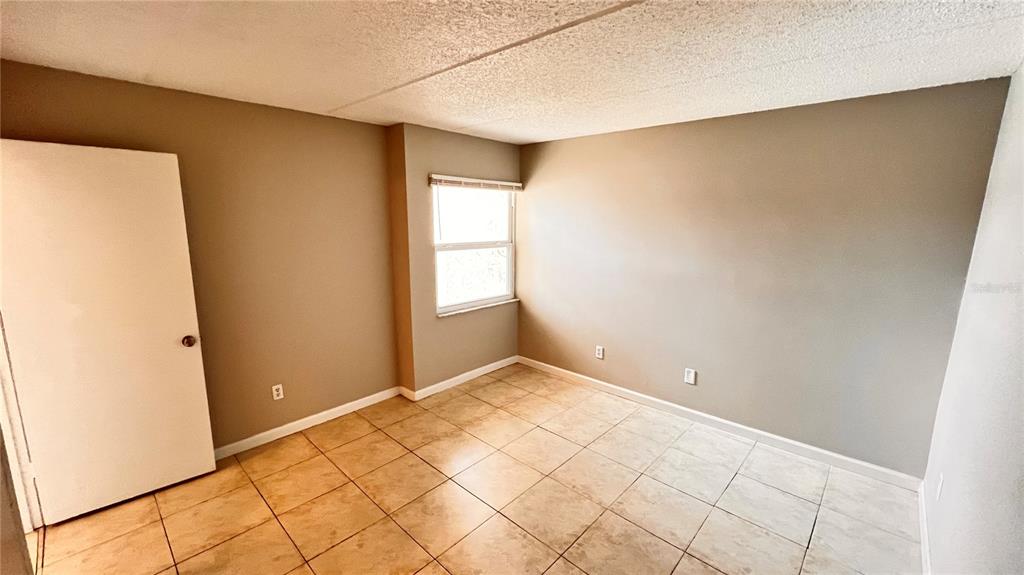 1902 Honour Road, Unit 24 Orlando, FL 32839 - Photo 22 of 25 a view of an empty room and window