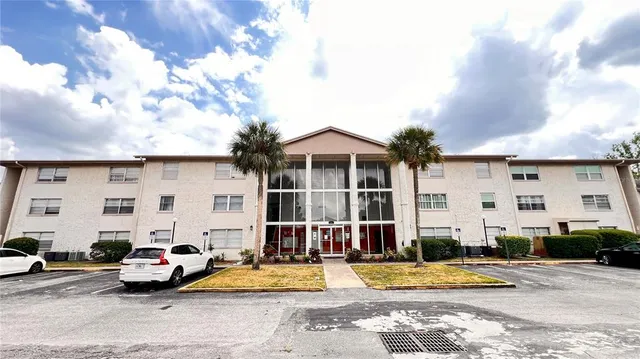 a kitchen with stainless steel appliances granite countertop a refrigerator sink and stove
