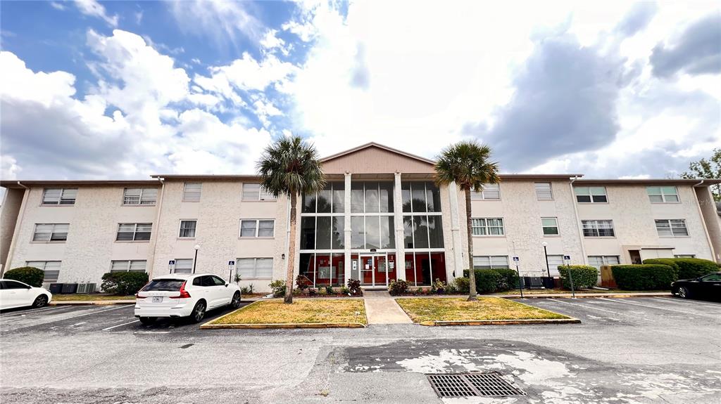1902 Honour Road, Unit 24 Orlando, FL 32839 - Photo 3 of 25 a car parked in front of a house