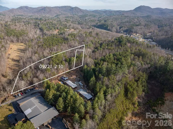an aerial view of residential house with an outdoor space