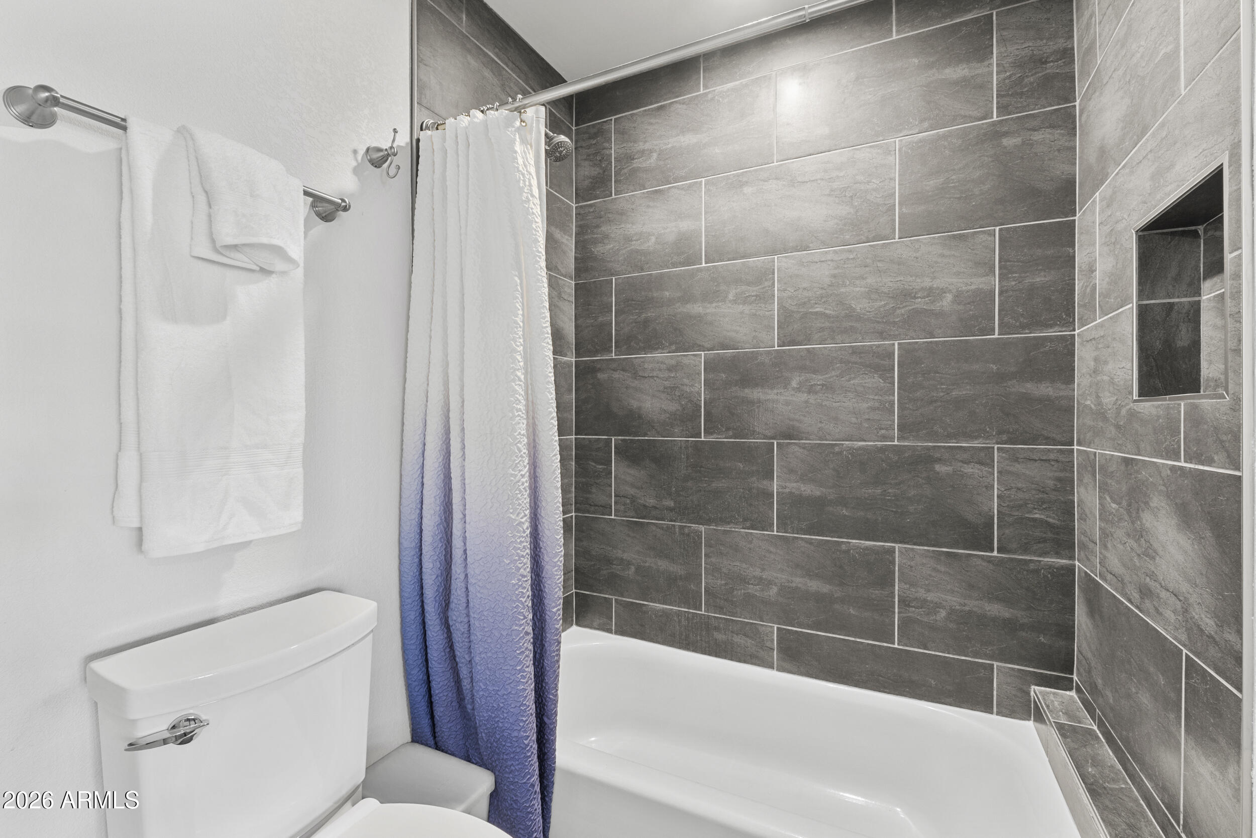 1608 East Weathervane Lane Tempe, AZ 85283 - Photo 18 of 33 a bathroom with a bathtub and a shower