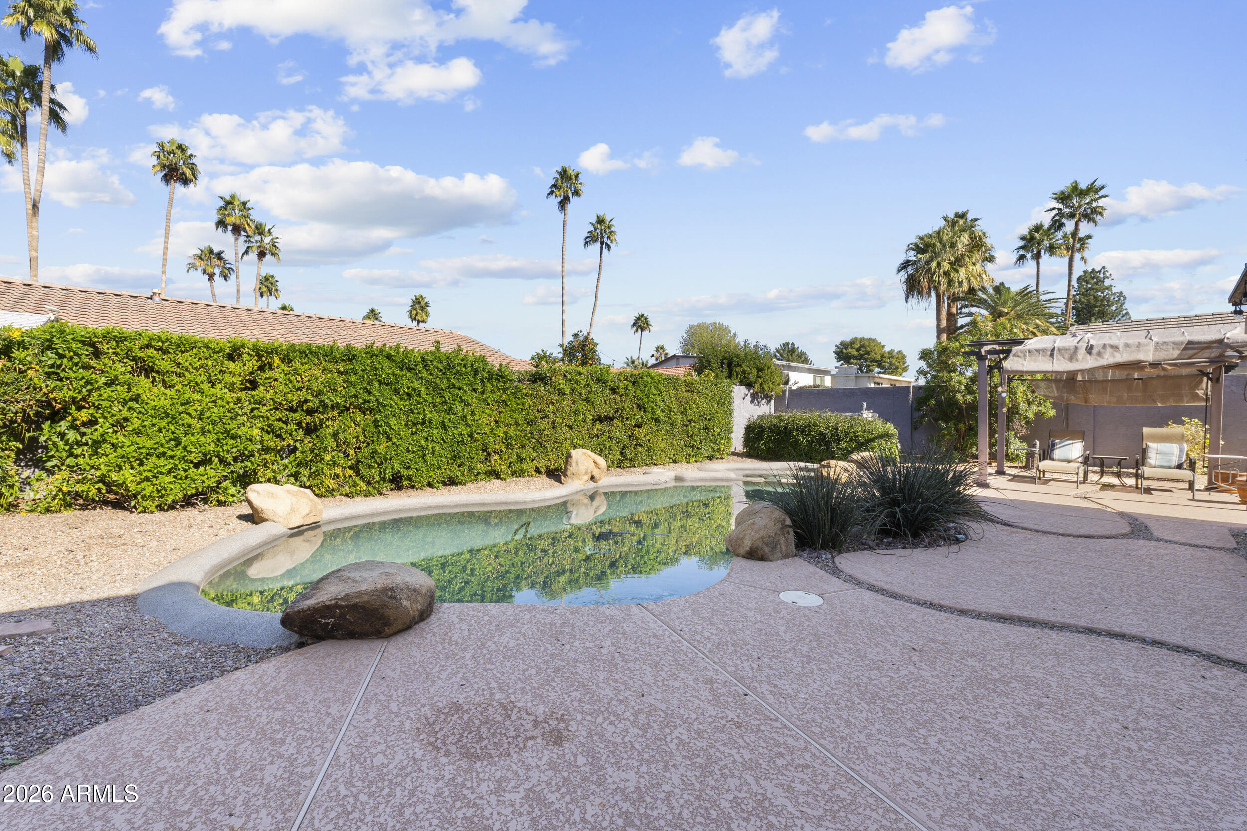 1608 East Weathervane Lane Tempe, AZ 85283 - Photo 28 of 33 a view of a chair and table in the garden