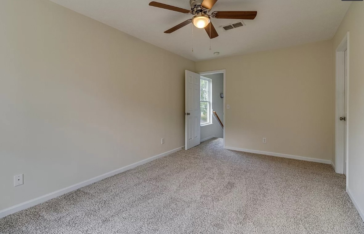 562 Flintlock Court Nashville, TN 37217 - Photo 11 of 20 a view of an empty room and chandelier fan