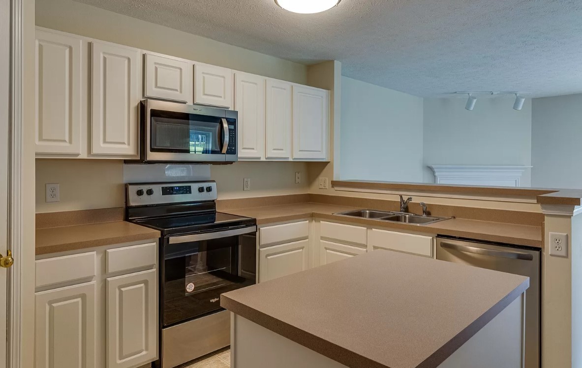 562 Flintlock Court Nashville, TN 37217 - Photo 5 of 20 a kitchen with cabinets appliances a sink and a counter top space