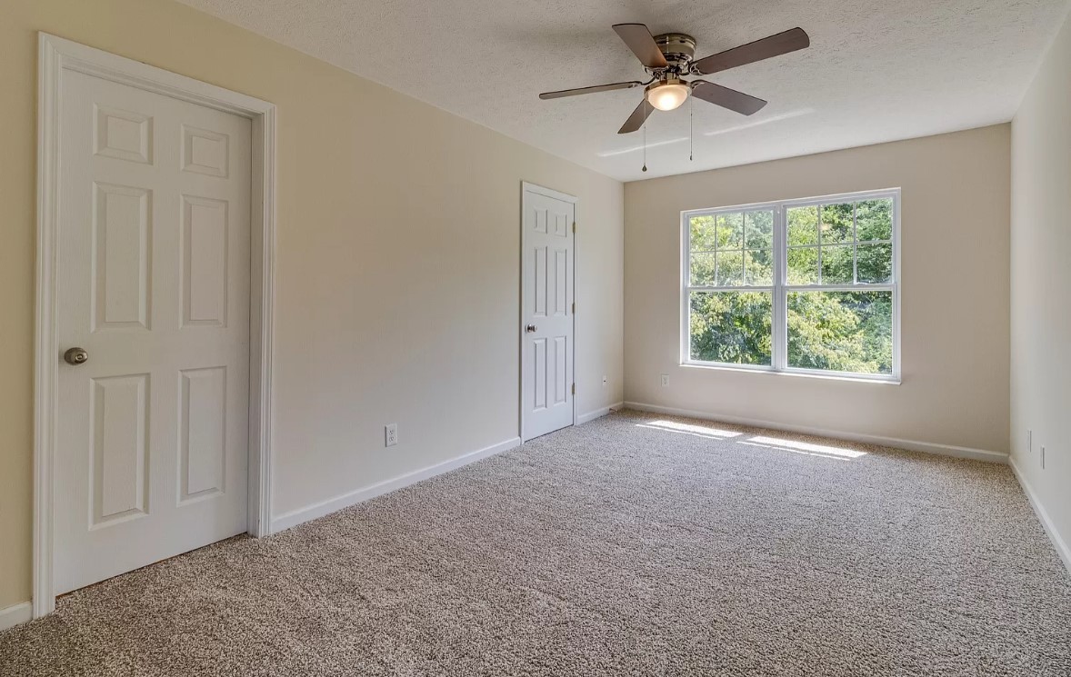 562 Flintlock Court Nashville, TN 37217 - Photo 9 of 20 an empty room with windows and fan