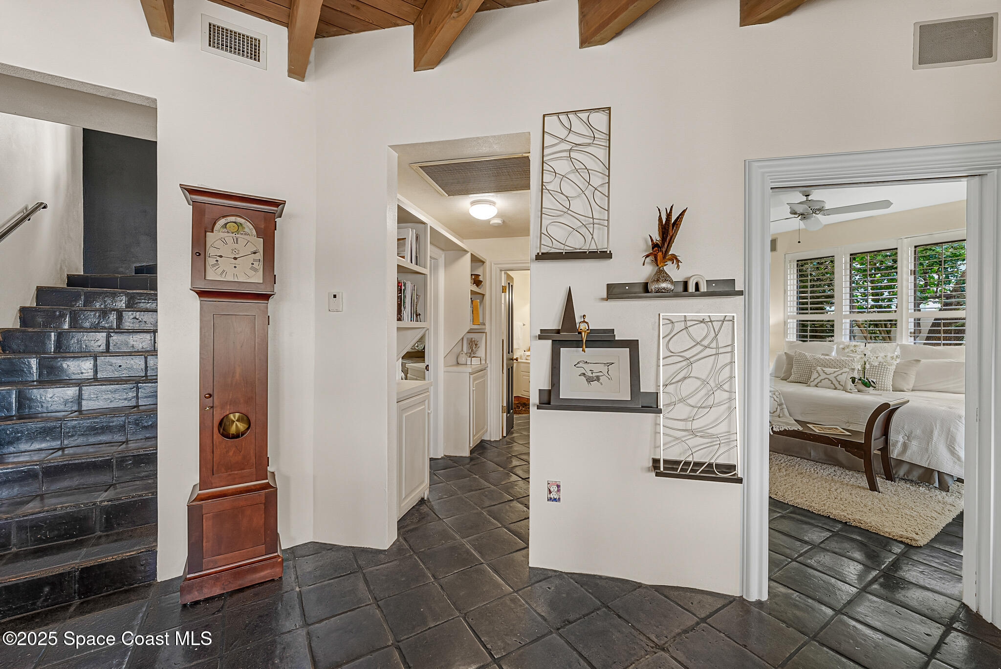 1025 Terry Drive Melbourne, FL 32935 - Photo 29 of 72 a kitchen with stainless steel appliances kitchen island granite countertop a refrigerator and a stove