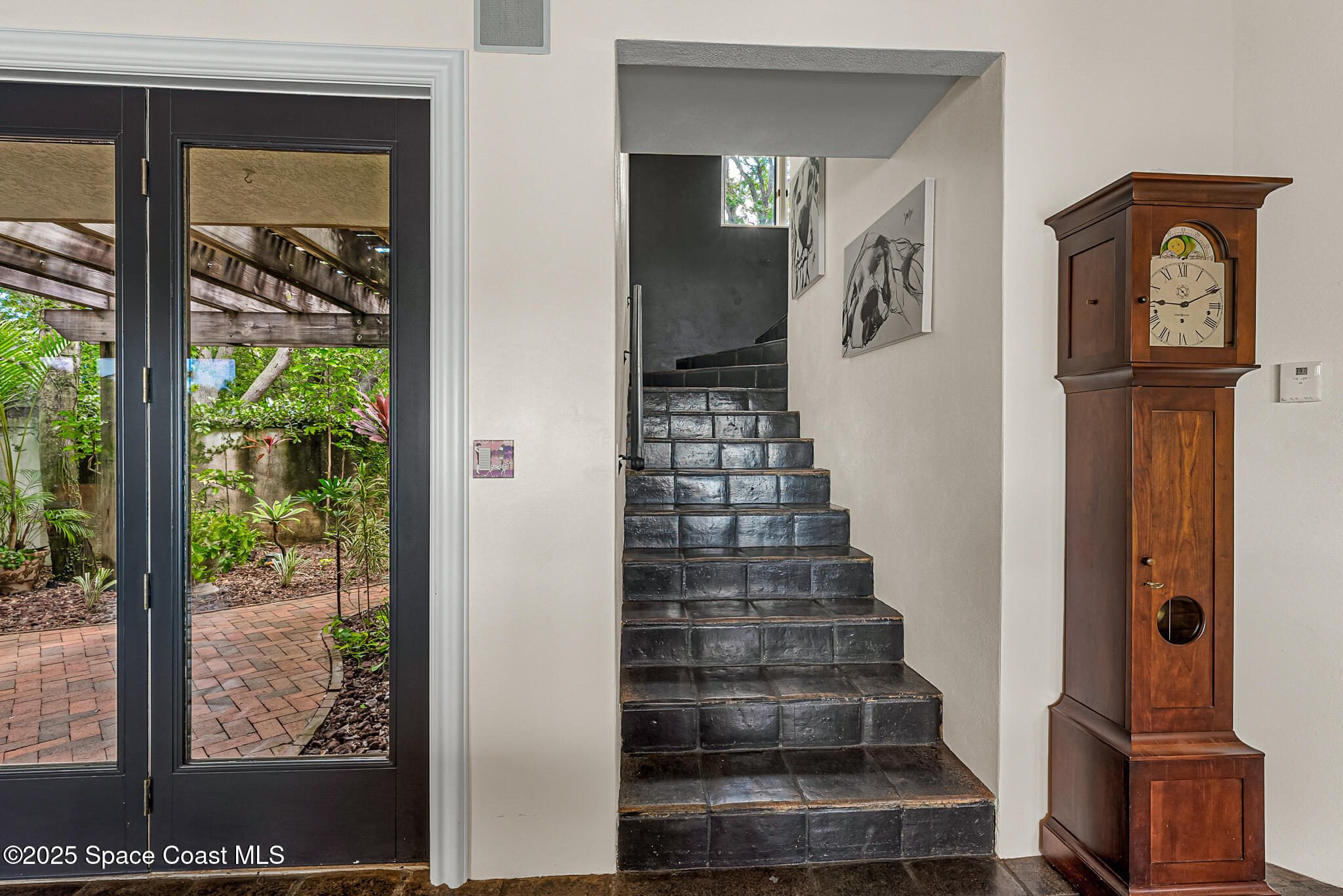 1025 Terry Drive Melbourne, FL 32935 - Photo 37 of 72 a view of a hallway with wooden floor and entryway